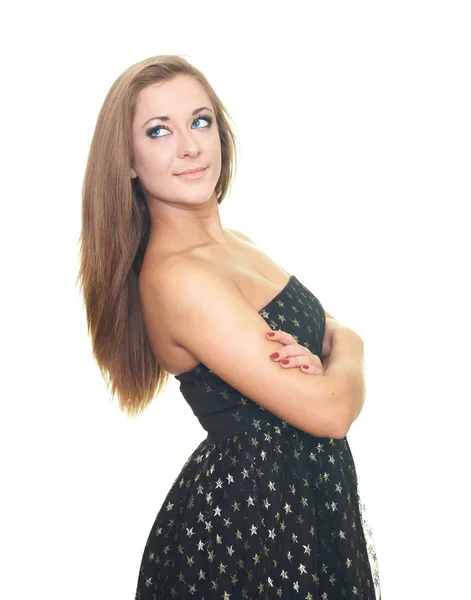 Attractive young woman in a black dress looking at the upper-rig — Stock Photo, Image