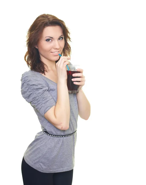 Attractive young woman in a gray T-shirt holding a glass of drin — Stock Photo, Image