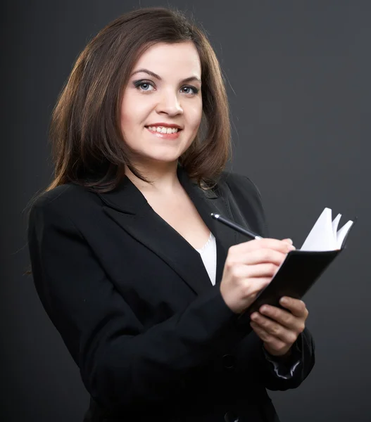 Geschäftsfrau mit Notizbuch in der Hand — Stockfoto