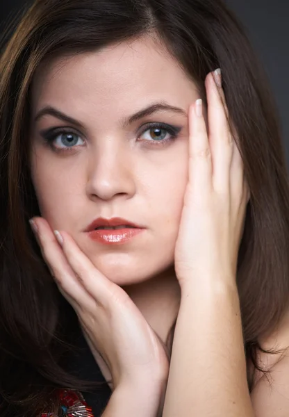 Portrait of attractive young woman in a black blouse. A woman hu — Stock Photo, Image