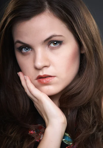 Portrait of attractive young woman in a black blouse. A woman hu — Stock Photo, Image