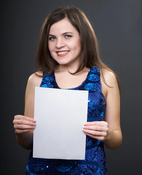 Attractive young woman in a blue dress. Woman holds a poster. — Stock Photo, Image