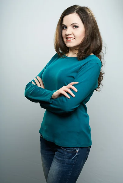 Happy young woman in a blue shirt and jeans. Woman standing with — Stock Photo, Image