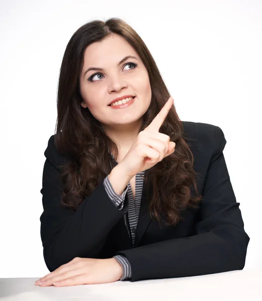 Happy young woman in black jacket sitting at the table. Woman sh — Stock Photo, Image