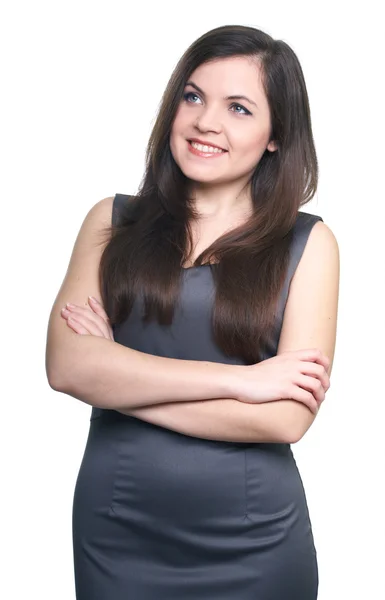 Attractive young woman in a gray business dress. Looks right. — Stock Photo, Image