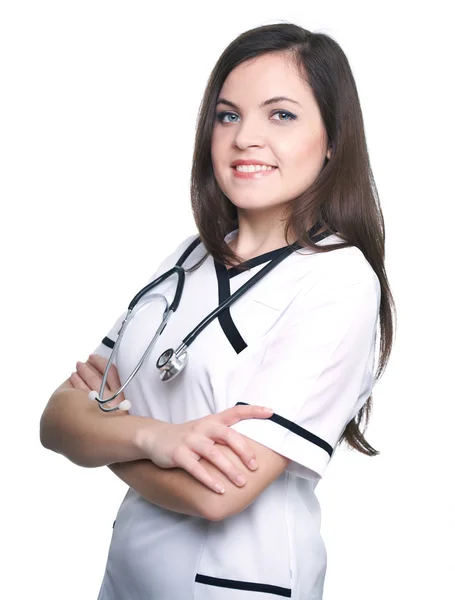 Ελκυστική νεαρή νοσοκόμα. γυναίκα να στέκεται με σταυρωμένα χέρια. — Φωτογραφία Αρχείου