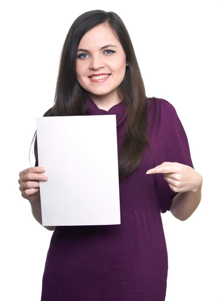 Attractive young woman in a dress. Woman holds a poster and poin — Stock Photo, Image