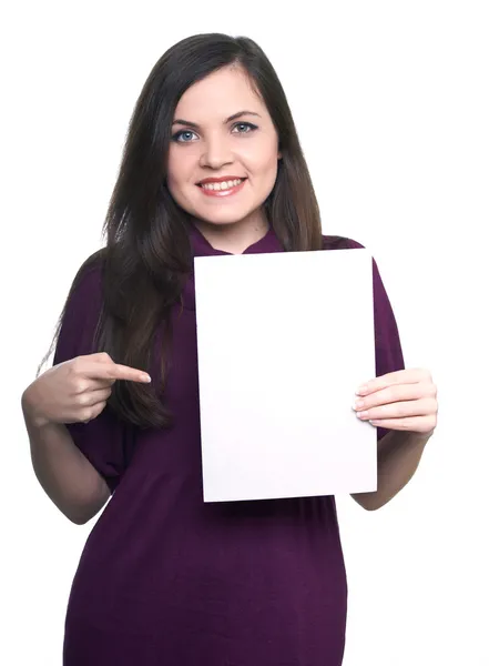 Attractive young woman in a dress. Woman holds a poster and poin — Stock Photo, Image