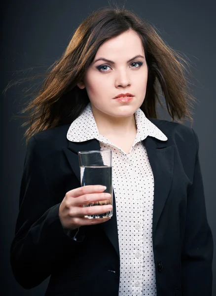 Attractive young woman in a black jacket. Woman holding a glass — Stock Photo, Image