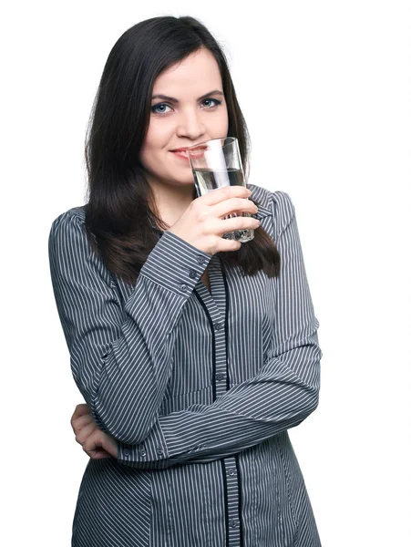 Attractive young woman in a gray blouse. Woman drinks mineral wa — Stock Photo, Image