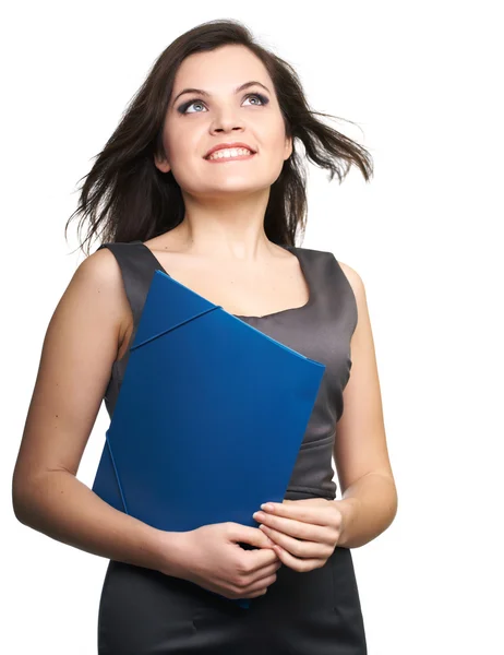 Attractive young woman in a gray business dress. Woman holds a b — Stock Photo, Image