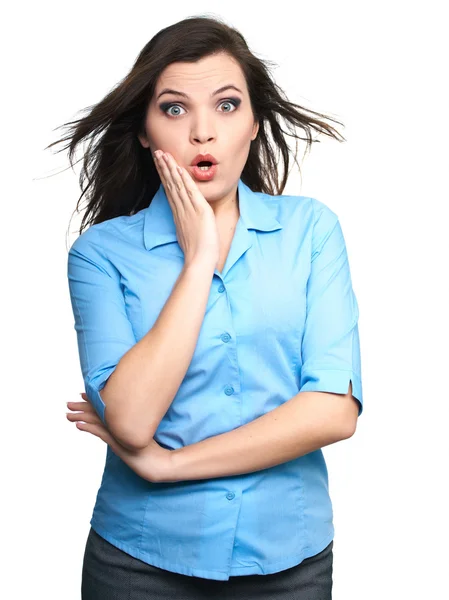 Surprised young woman in a blue shirt. Hair in motion. — Stock Photo, Image