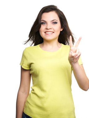 Sarı gömlekli çekici genç kadın. kadın bir sembolü o gösterir