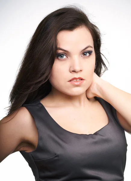 Attractive young woman in a gray business dress. — Stock Photo, Image