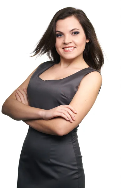 Attraktiv ung kvinna i en grå business klänning. — Stockfoto