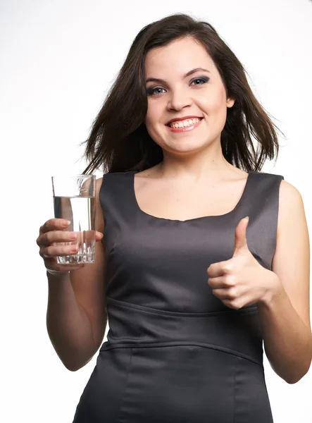 Attractive young woman in a gray business dress. Woman holding a — Stock Photo, Image