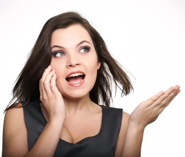 Portrait of attractive young woman in a gray dress. Woman talkin — Stock Photo, Image