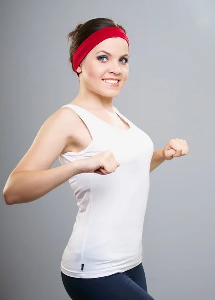 Una joven atractiva en ropa deportiva. Mujer dedicada al fitness . — Foto de Stock