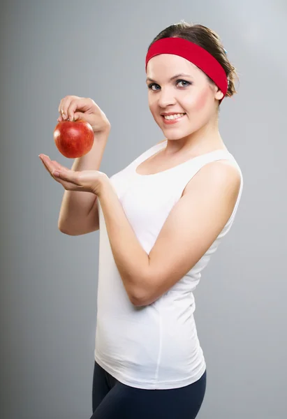 Attractive young woman in a white T-shirt. Woman holds a red app — Stock Photo, Image