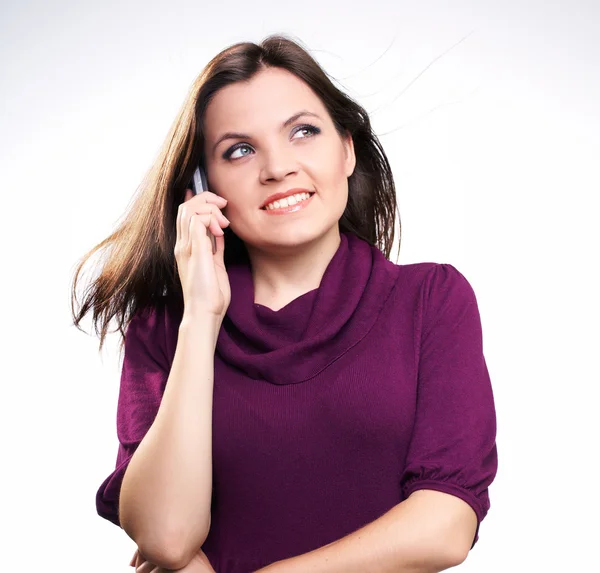 Attractive young woman in a dress. Woman talking on a mobile pho — Stock Photo, Image