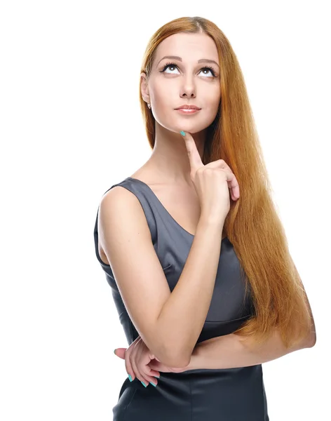 iş gri elbiseli çekici genç kadın. yukarıya bakıyor.