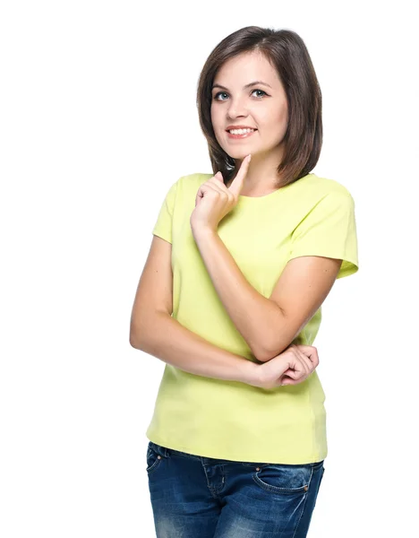 有魅力的年轻女人在黄色的衬衫和蓝色牛仔裤。举行 — 图库照片
