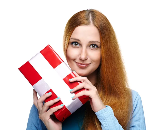 Attractive young woman in a blue shirt. Holds a gift box. Isolat — Stock Photo, Image
