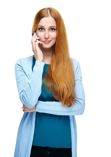 Attractive young woman in a blue shirt. Talking on a mobile phon — Stock Photo, Image