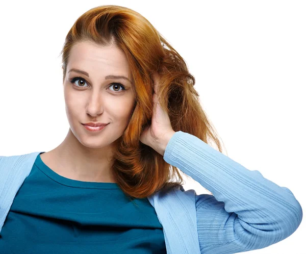 Attractive young woman in a blue shirt. Makes a haircut. Long re — Stock Photo, Image