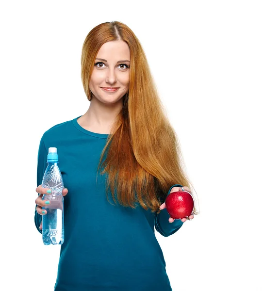 Attractive young woman in a blue shirt. Holding a bottle of mine — Stock Photo, Image