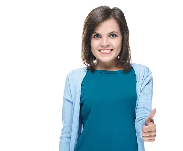 Attractive young woman in a blue shirt. Showing thumbs up. — Stock Photo, Image