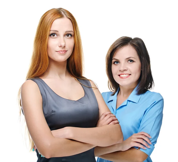 Two attractive girls in business clothes. Standing with folded h — Stock Photo, Image