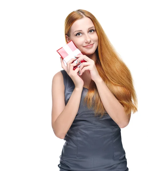 Attractive young woman in a gray business dress. Holds a gift bo — Stock Photo, Image