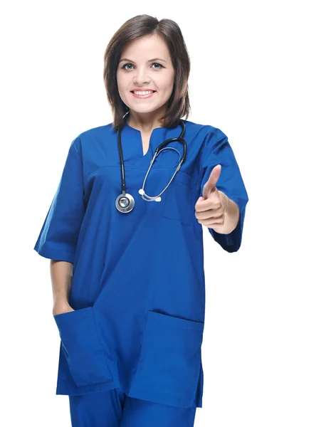 Jovem enfermeira atraente de uniforme. A mostrar os polegares para cima. Isolados — Fotografia de Stock