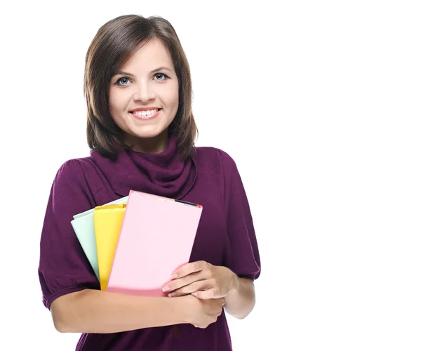 Attractive young woman in a red dress. Holds a colorful book. — Stock Photo, Image