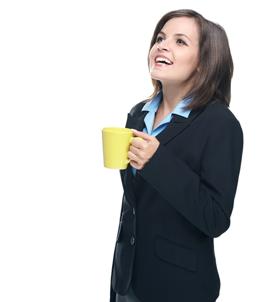 Attractive young woman in a black jacket. Holds a a yellow cup. — Stock Photo, Image