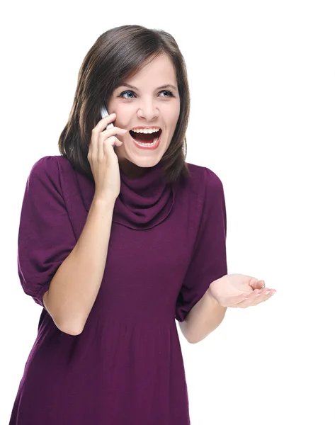 Attraktive junge Frau im roten Kleid. Telefonieren auf dem Handy — Stockfoto