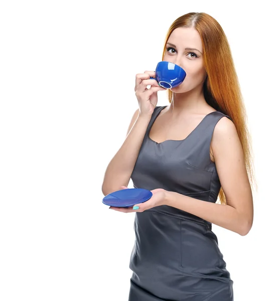 Attractive young woman in a gray business dress. Drinking from a — Stock Photo, Image