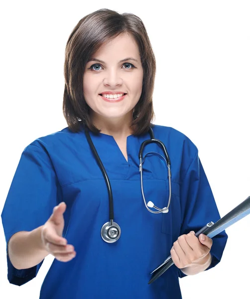 Attractive young nurse in uniform. Holds a folder and gives a ha — Stock Photo, Image