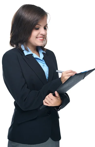 Ελκυστική νεαρή γυναίκα σε ένα μαύρο επαγγελματικό κοστούμι. κατέχει ένα φάκελο — Φωτογραφία Αρχείου