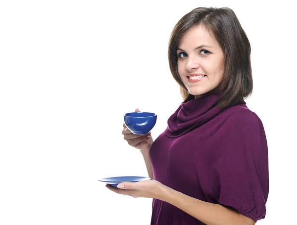 Attractive young woman in a red dress. Holds a blue cup and sauc — Stock Photo, Image