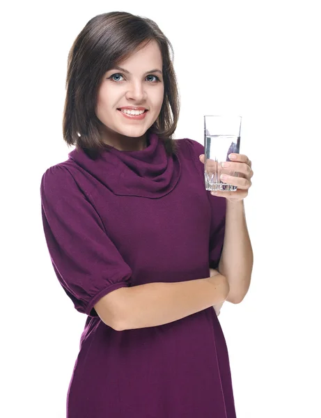 Attractive young woman in a red dress. Holding a glass of minera — Stock Photo, Image