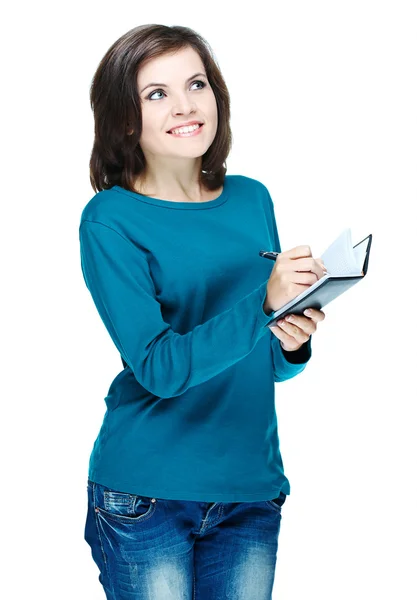 Attraente ragazza sorridente in una camicia blu che tiene un notebook e w — Foto Stock