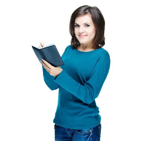 Muchacha sonriente atractiva en una camisa azul sosteniendo un cuaderno y w —  Fotos de Stock