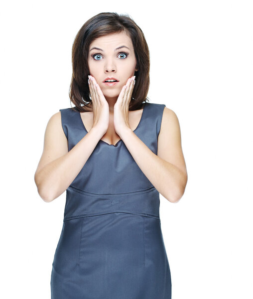 Surprised young woman in a gray business dress.