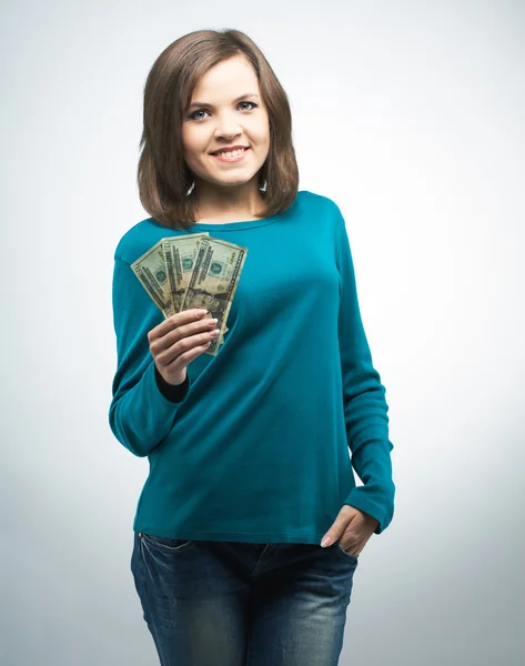 Attractive young woman in a blue shirt. Holding money. — Stock Photo, Image