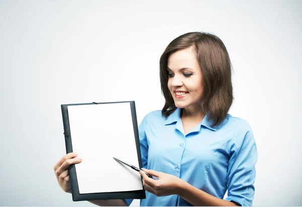 Happy young woman in a blue blouse. Holds a poster and points on — Stock Photo, Image