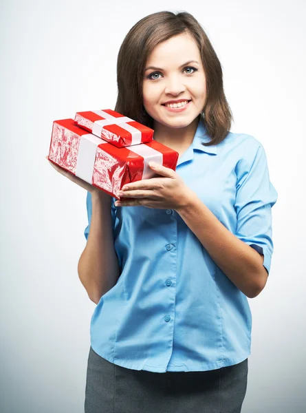 Attractive young woman in a blue shirt. Holding red gift box. — Stock Photo, Image