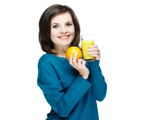Happy young smiling girl in a blue shirt. Holding a glass of jui — Stock Photo, Image