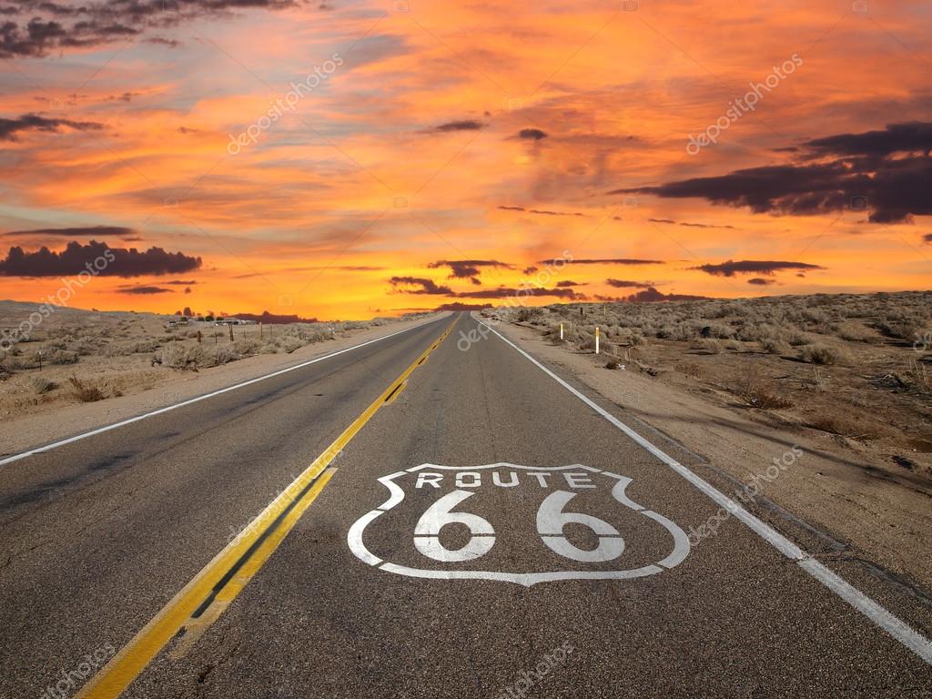 Route 66 pavement sign sunrise in California's Mojave desert.
